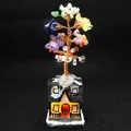 Handcrafted seven chakra natural crystal money tree ornament with a lighted cottage base - Chakra Energy Tree