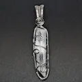 Close-up of handmade silver wire-wrapped clear quartz crystal hexagonal point pendant - Clear Quartz (Silver-tone Wrapped)