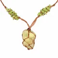 Detail of raw yellow fluorite pendant wrapped in handcrafted brown woven net bag - Hand-Woven Net Pouch / Citrine