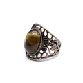 Macro detail of medieval style hollow copper ring with an oval tiger eye stone - Tiger's Eye