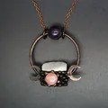 Close-up of medieval vintage pendant necklace with crystal and amethyst-like stones - Triple Moon Style / White Quartz Point Necklace