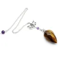 Close-up of faceted Tiger's Eye dowsing pendulum with lotus Om charm and silver chain - Tiger's Eye