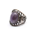 Close-up view of a medieval retro hollow ring with an oval purple natural stone - Amethyst