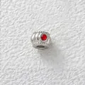 Close-up detail of silver stainless steel bead with red cubic zirconia for DIY jewelry - Ridged Round Red Zirconia Bead (Z1-1) / Steel Color (with Red Zirconia)