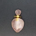 Detailed macro shot of a faceted rose quartz essential oil bottle pendant with gold bail. - Rose Quartz