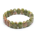 Detail of faceted natural Unakite stone bracelet with unique green and pink patterns. - Unakite