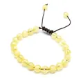 Detailed view of 8mm natural yellow stone beads on hand-woven adjustable bracelet - Citrine