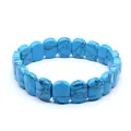 Close-up detail of faceted blue turquoise stone beads on an elastic stretch bracelet. - Faceted Panel Style / Blue Turquoise