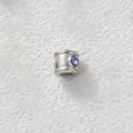Detail shot of stainless steel spacer bead with inset blue zircon for DIY jewelry. - Cylindrical Through-Hole Bead (Z2-4) / Steel Tone With Blue Zirconia