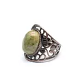 Close-up view of a vintage hollow ring featuring a natural oval unakite green gemstone. - Unakite