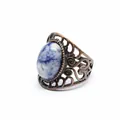 Detailed close-up of a vintage medieval style hollow ring with blue natural stone. - Blue Spot Jasper
