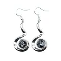 Close-up of silver-toned drop earrings featuring round snowflake obsidian stones - Snowflake Obsidian