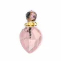Detailed view of a faceted natural rhodonite teardrop perfume bottle pendant with gold accents - Rhodonite