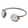Detailed macro view of vintage open cuff bracelet with raw natural crystal stones - White Crystal