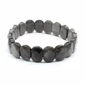 Detailed close-up of a faceted silver sheen obsidian stone bracelet on white background - Faceted Panel Style / Silver Obsidian