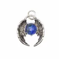 Macro detail of a natural lapis lazuli bead nestled in silver angel wings pendant. - Lapis Lazuli