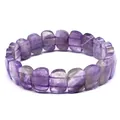 Close-up of faceted purple amethyst stone rectangular beads on a handcrafted bracelet. - Amethyst