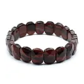 Macro view of faceted natural red tiger eye stone bracelet showing distinct texture - Red Tiger Eye