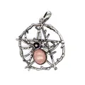 Close-up of vintage silver spider web pendant with pink natural stone and black gem - Rhodonite