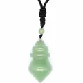 Macro view of a faceted green aventurine cone-shaped pendant with black braided cord - Aventurine Jade