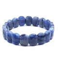 Detailed macro shot of a faceted natural blue stone bracelet showing stone texture - Blue Aventurine