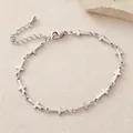 Pulsera elegante de acero inoxidable plateado con múltiples dijes de cruz finos - 18.5cm / Plateado