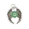 Close-up view of a silver angel wing pendant featuring a round green crystal bead - Aventurine Jade