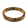 Close-up of natural tiger eye square faceted stone bracelet on white background - Tiger's Eye
