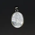 Detailed view of religious Virgin Mary carving on iridescent mother of pearl pendant. - Virgin of Guadalupe Style (aljylp1797) / Silver