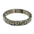 Close-up of a minimalist square-cut natural stone bracelet with metallic pyrite texture - Hematite