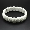 Close-up of white faceted howlite stone bracelet with grey marble pattern - Howlite