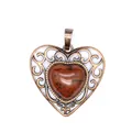 Macro detail of a vintage heart pendant with brown stone and bronze filigree - Mahogany Obsidian