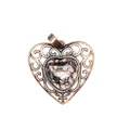 Close-up of vintage heart pendant with natural rhodonite and ornate bronze metalwork - Rhodonite
