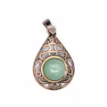 Detailed view of hollow water drop pendant with green natural stone and bronze filigree - Aventurine Jade