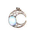 Macro view showing the intricate hollow design of this vintage bronze crescent moon pendant - Opal