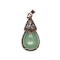 Detailed view of a vintage green teardrop stone pendant with antique bronze filigree cap - Aventurine Jade