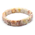 Macro detail view of square faceted marbled natural stone beads on an elastic stretch bracelet - Red Network Stone