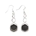 Detailed macro view of spiral silver drop earrings with black hexagonal stone inlay. - Obsidian