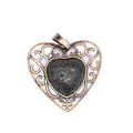Detailed view of a vintage hollowed heart pendant featuring a textured natural lava stone. - Lava Stone
