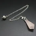 Detailed view of a hexagonal rose quartz crystal pendulum with ornate silver chain - Rose Quartz