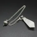 Detail shot of a hexagonal natural white crystal pendulum pendant with a silver chain - White Crystal