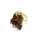 Detailed macro view of an iridescent agate druzy stone set in a gold-plated ring. - Ring (⑤)
