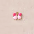 Detailansicht eines rosa zweifarbigen Schleifenanhängers mit vergoldetem Rand für DIY - Rosa Schleife