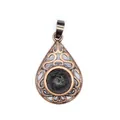 Close-up of hollow water-drop pendant featuring black lava stone and bronze metal - Lava Stone
