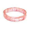 Macro view of a pink natural stone square faceted bracelet showing elegant translucent texture - Watermelon red