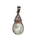 Detail shot of vintage bronze waterdrop pendant with natural semi-precious stone - Labradorite