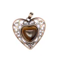 Close-up of vintage bronze hollow heart pendant with polished tiger eye stone - Tiger's Eye