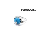 Elegant silver-toned ring featuring a blue turquoise stone and a delicate micro-pave flower - Blue Turquoise