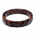 Close-up of faceted square red tiger eye stone beads on a durable stretch bracelet. - Red Tiger Eye