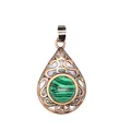 Detailed view of teardrop pendant featuring bronze filigree and green malachite stone - Malachite